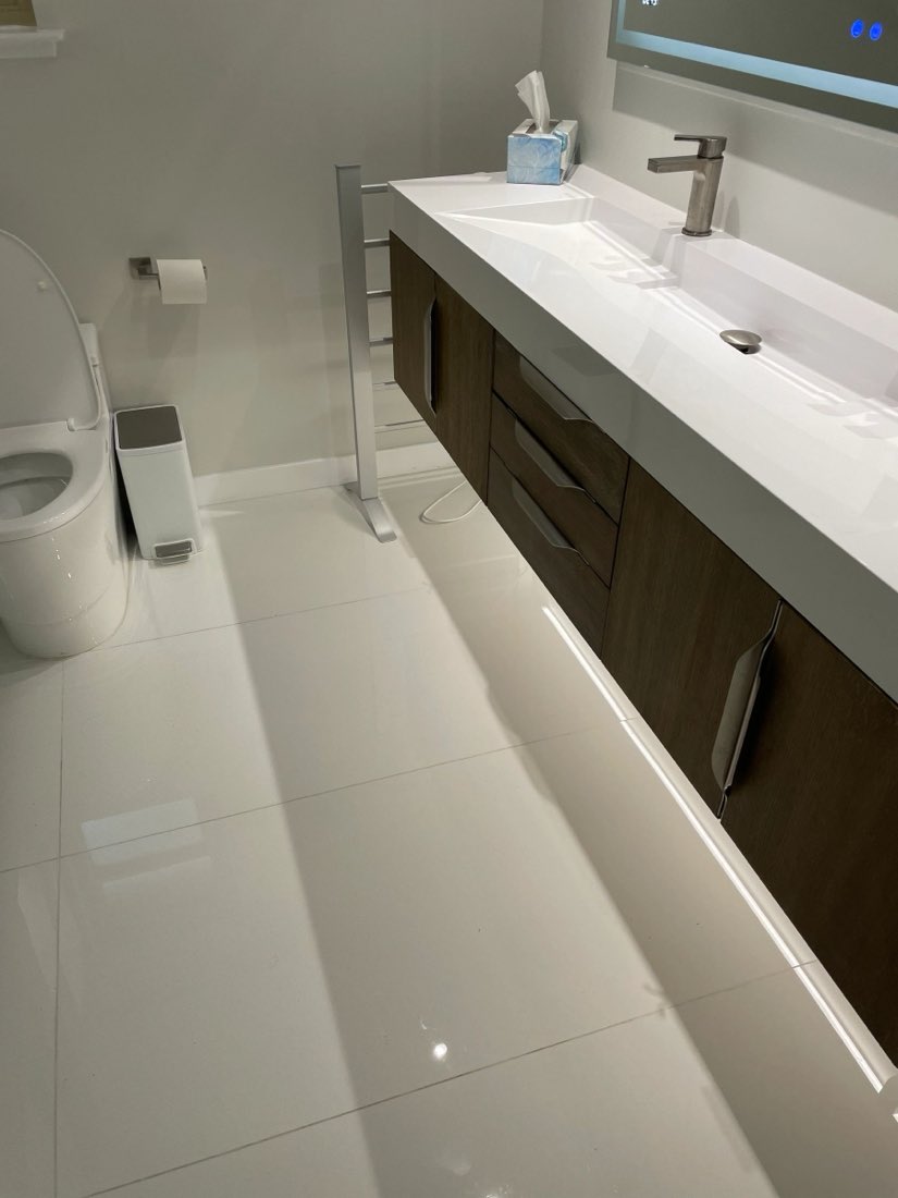 Finished bathroom with floating vanity and new fixtures