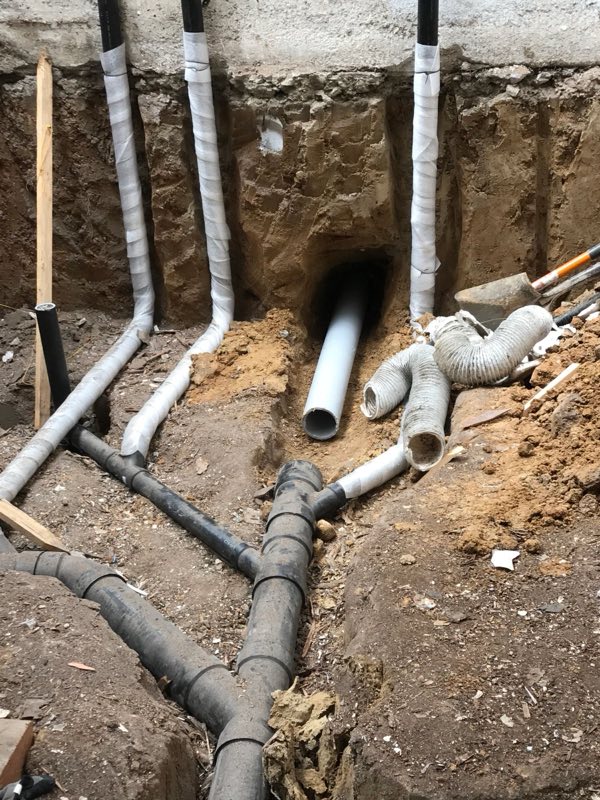 New ABS drain fittings set in a trench