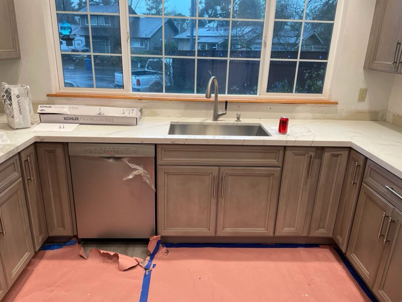 Floor protection laid down before work begins inside a customer's kitchen